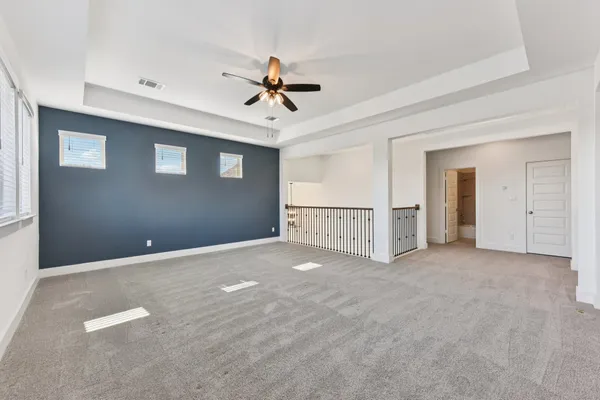 a view of an empty room and wooden floor
