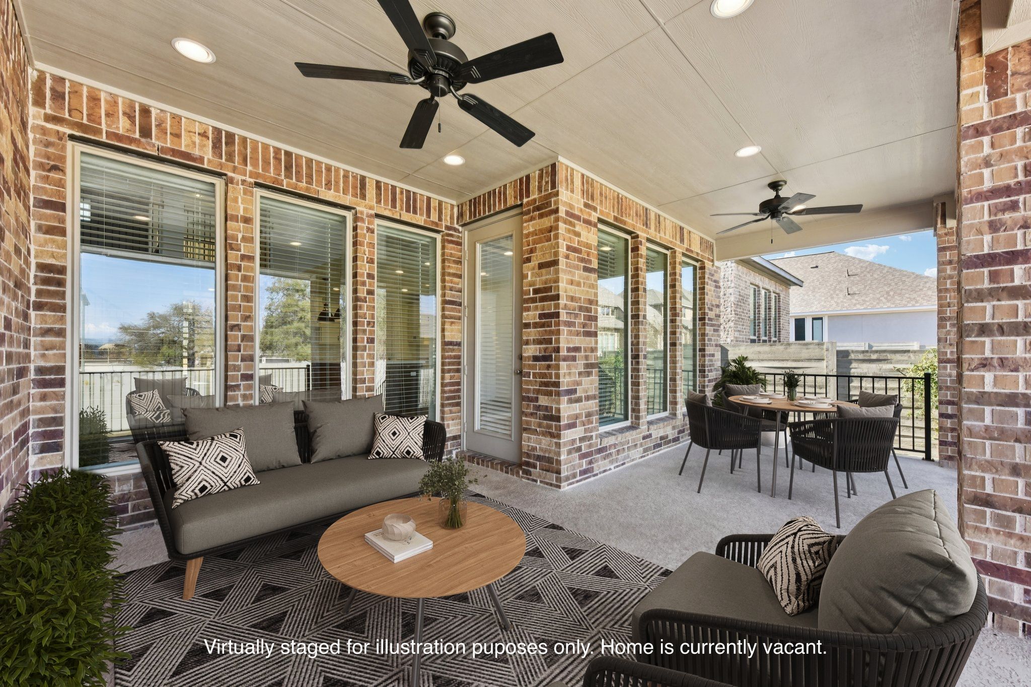 225 Ashmore Lane Georgetown, TX 78628 - Photo 28 of 36 Extend your entertaining space or enjoy your morning coffee in the extended covered patio. (Virtually staged for illustration purposes only)