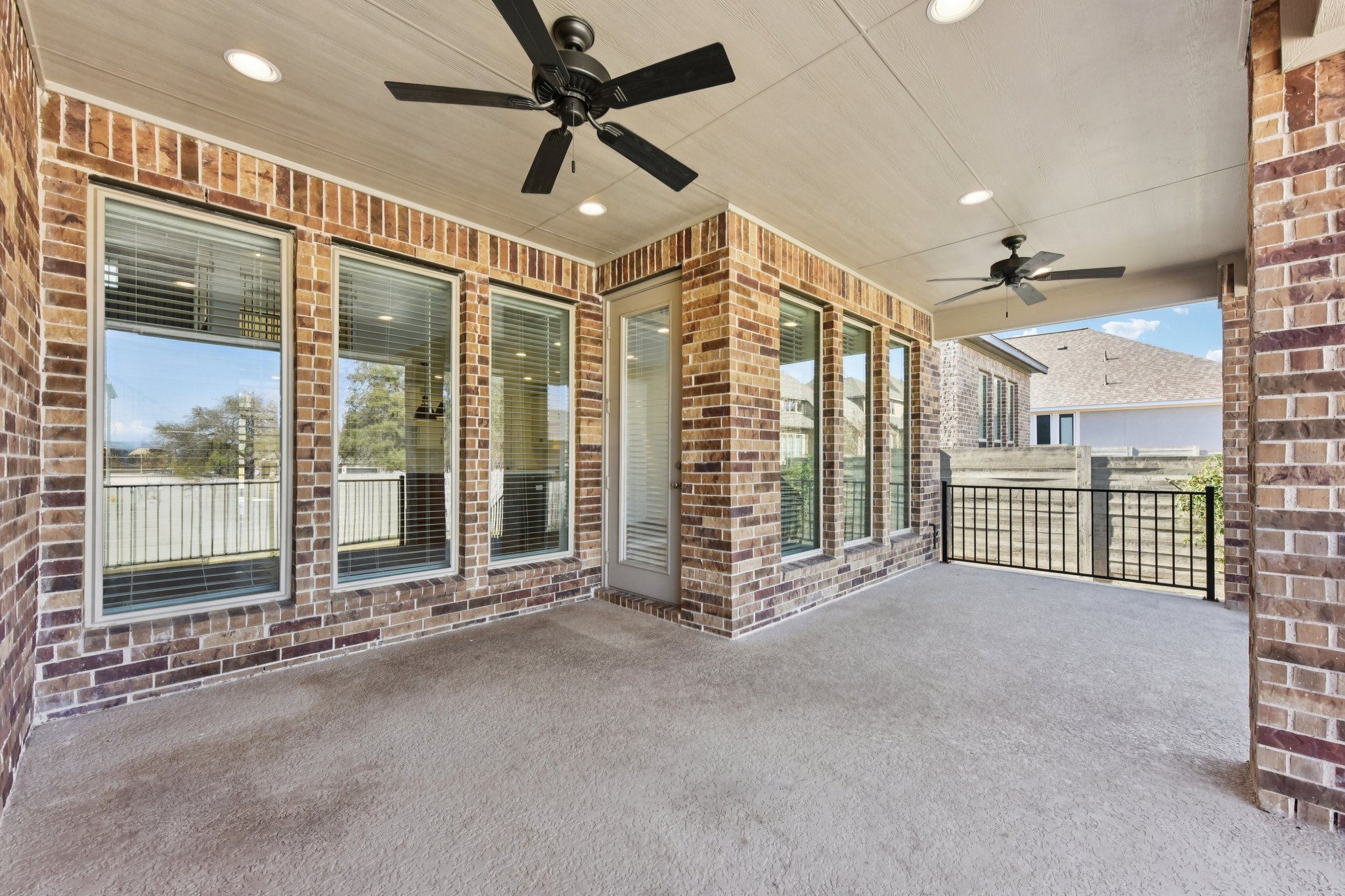 225 Ashmore Lane Georgetown, TX 78628 - Photo 29 of 36 Extend your entertaining space or enjoy your morning coffee in the extended covered patio.
