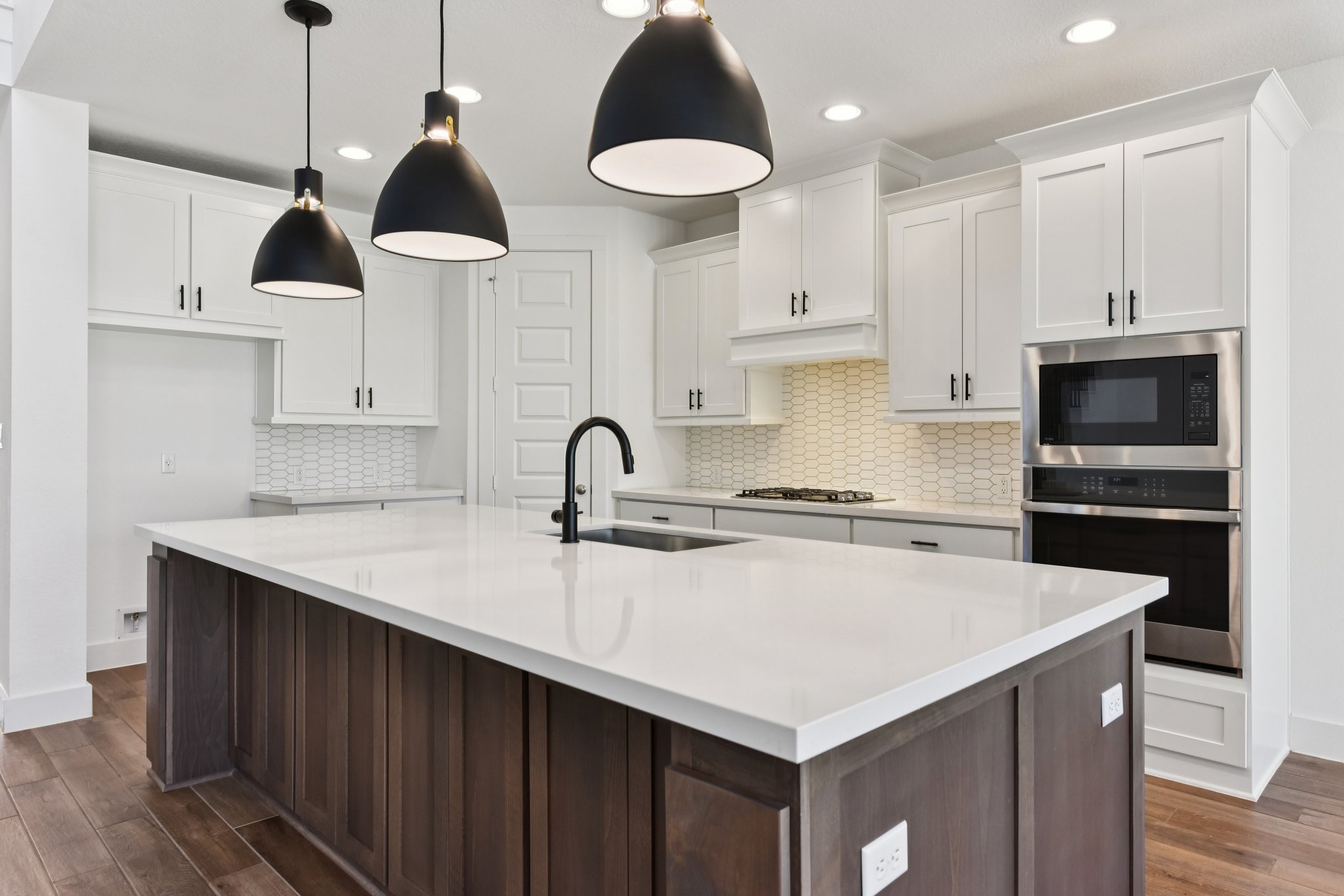 225 Ashmore Lane Georgetown, TX 78628 - Photo 5 of 36 Crisp white kitchen with center island is a standout!