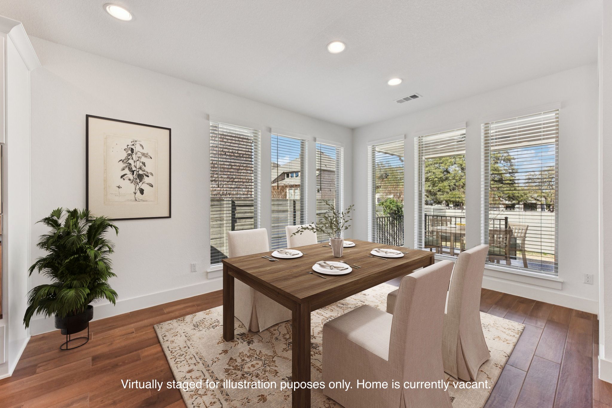 225 Ashmore Lane Georgetown, TX 78628 - Photo 8 of 36 Dining area is surrounded by floor to celing windows, Large enough for holiday dinners. Notice no direct house behind the windows, just a beautiful tree! (Virtually staged for illustration puposes only)