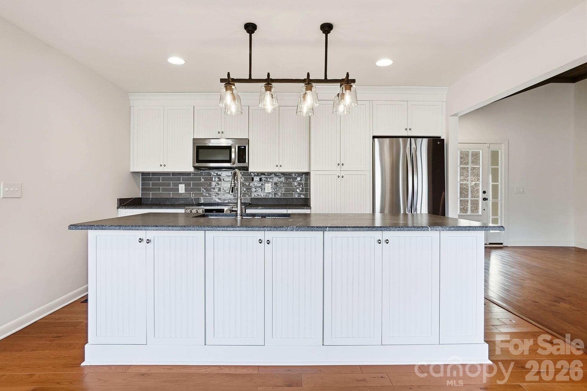 2295 Sussex Road York, SC 29745 - Photo 12 of 47 a kitchen with stainless steel appliances a refrigerator and cabinets