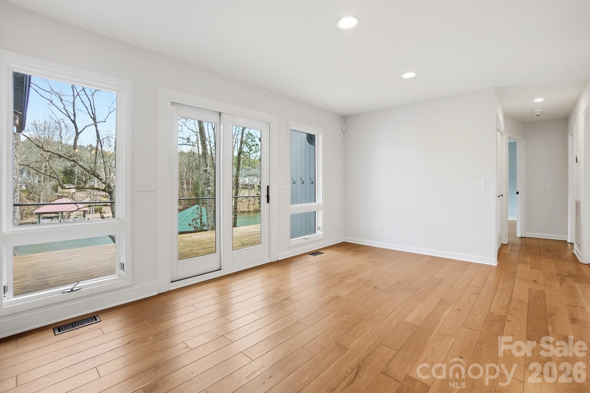 2295 Sussex Road York, SC 29745 - Photo 16 of 47 a view of an empty room with wooden floor and a window