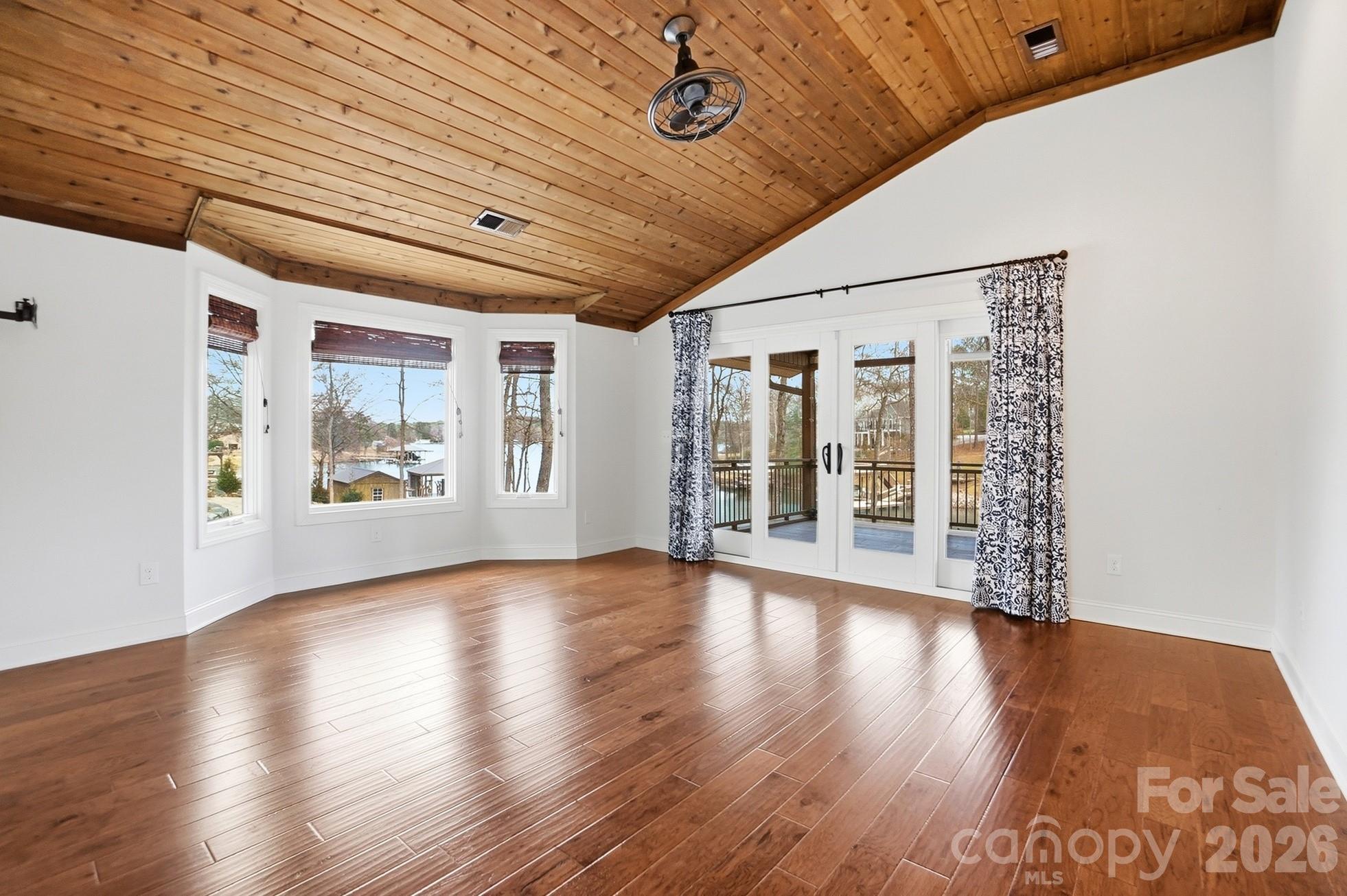 2295 Sussex Road York, SC 29745 - Photo 18 of 47 a view of an empty room with wooden floor and a window