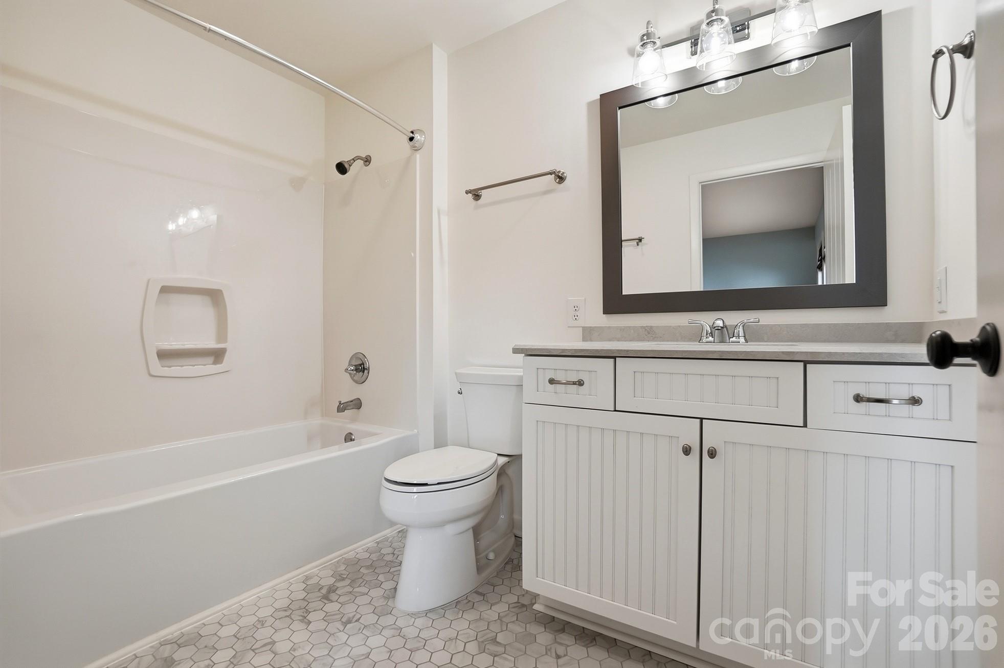 2295 Sussex Road York, SC 29745 - Photo 26 of 47 a bathroom with a toilet a sink a mirror a bathtub and vanity