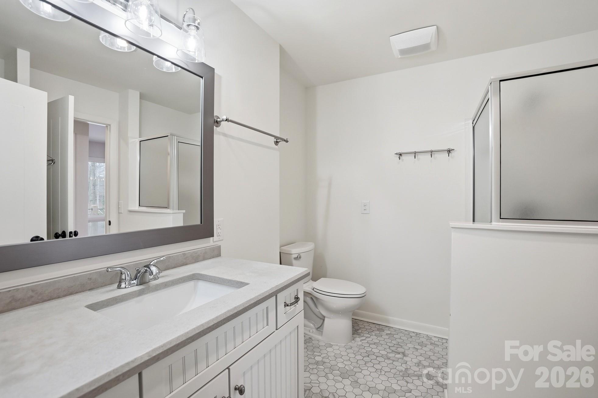 2295 Sussex Road York, SC 29745 - Photo 30 of 47 a bathroom with a granite countertop sink toilet and shower