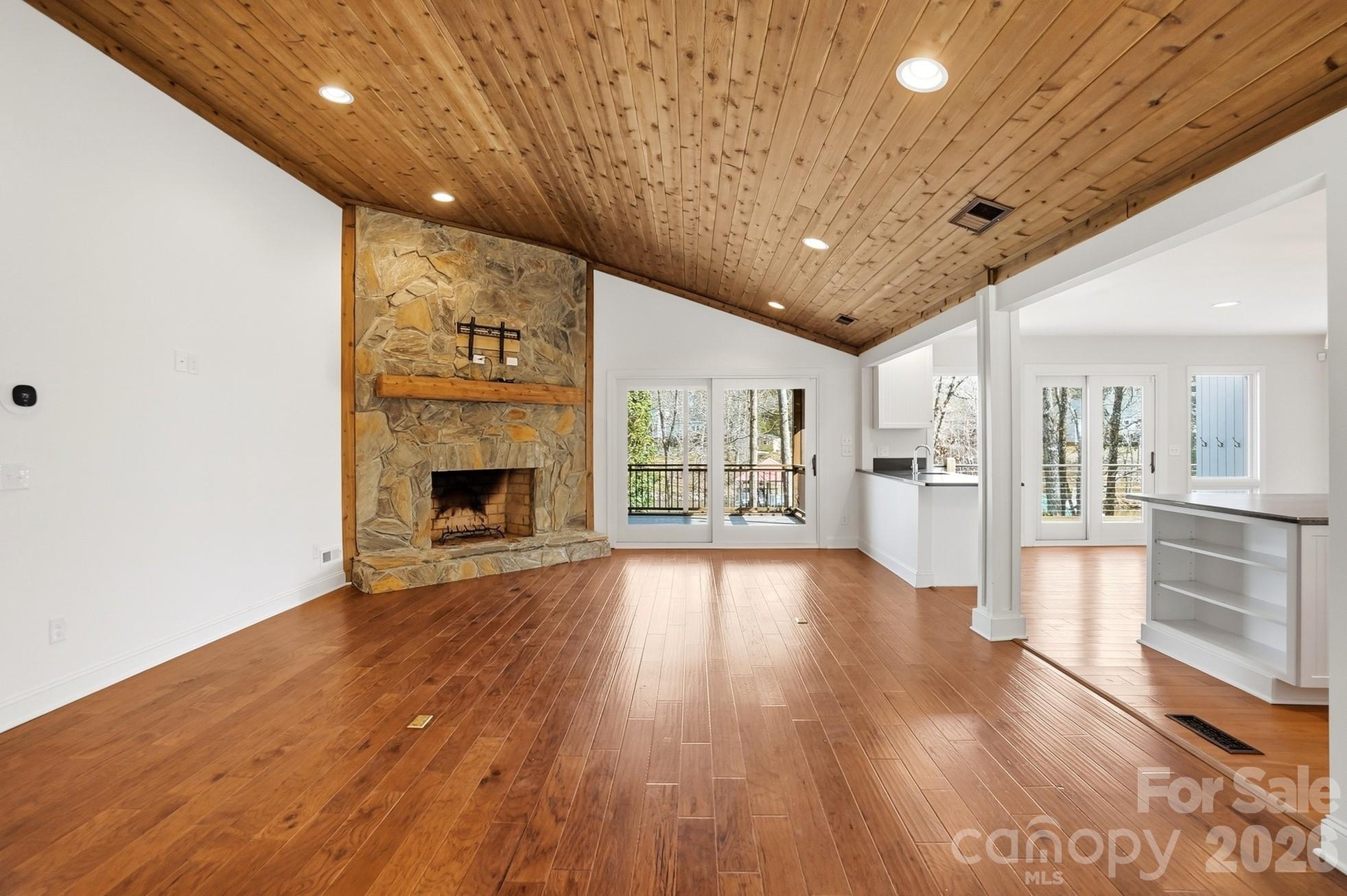 2295 Sussex Road York, SC 29745 - Photo 7 of 47 a view of an empty room with wooden floor and a fireplace