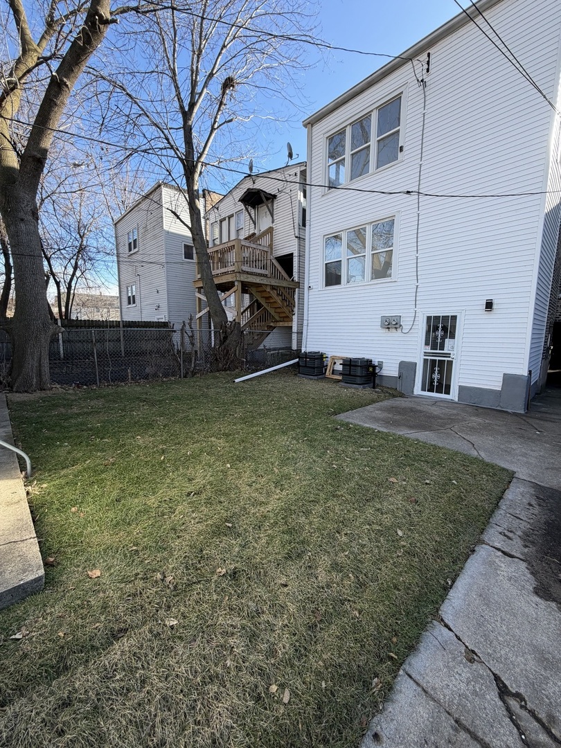 1048 West Marquette Road, Unit 1 Chicago, IL 60621 - Photo 13 of 13 a view of a house with a yard