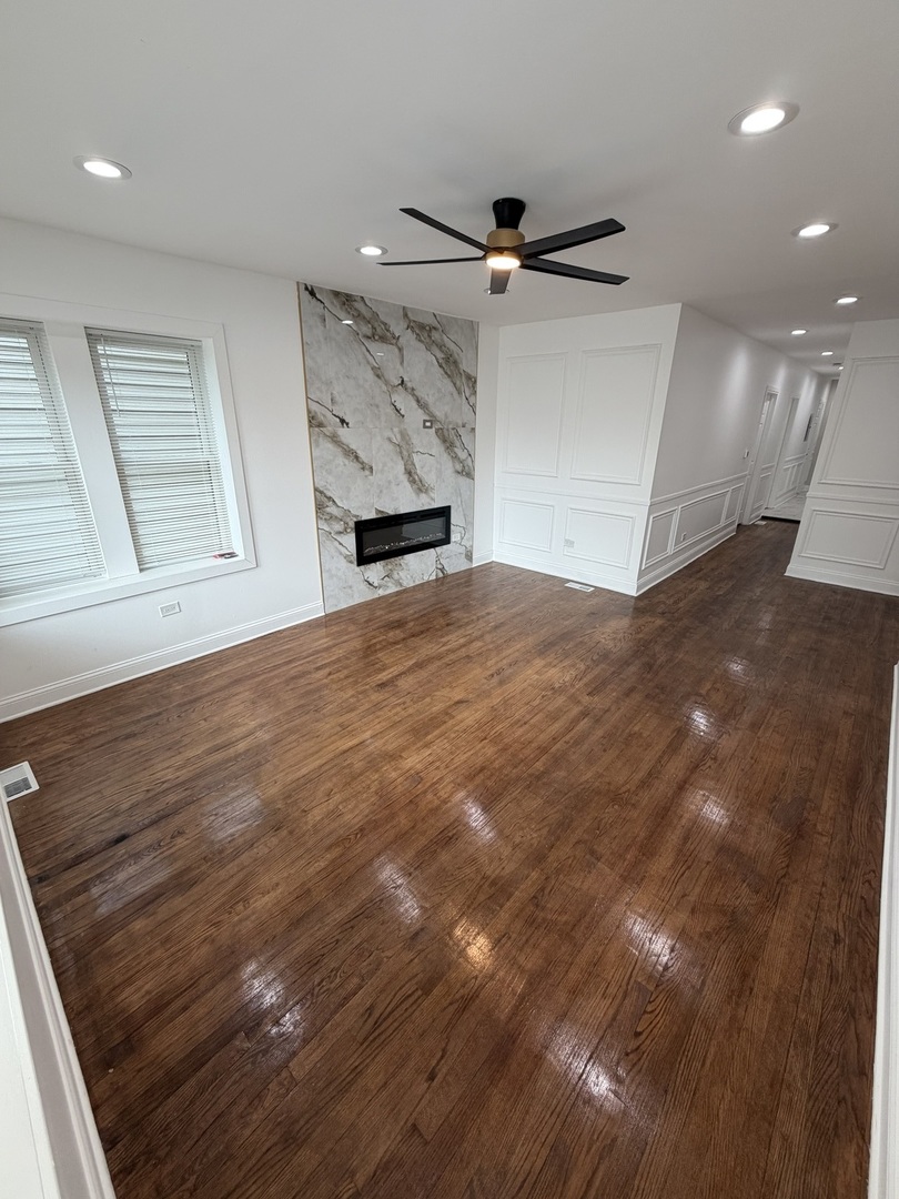 1048 West Marquette Road, Unit 1 Chicago, IL 60621 - Photo 3 of 13 a view of empty room with wooden floor