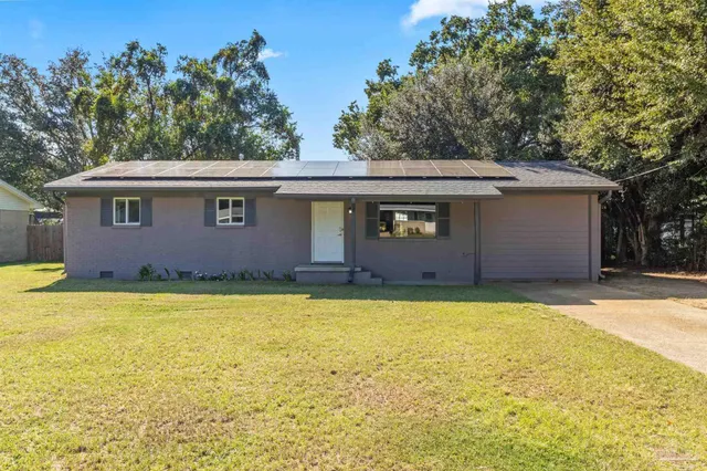 a view of a swimming pool with an outdoor space and seating area