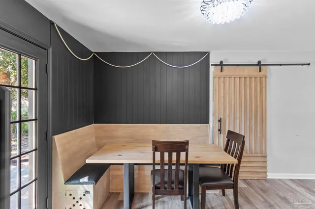 a kitchen with a table and refrigerator