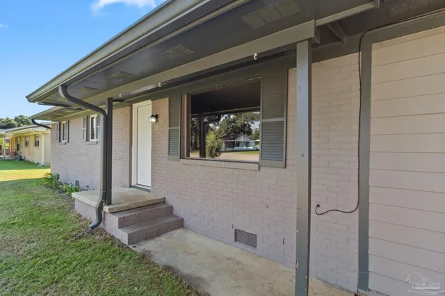 a view of house with backyard