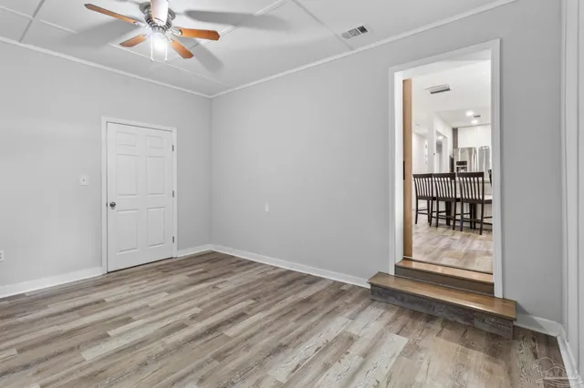 a view of hallway with window and furniture