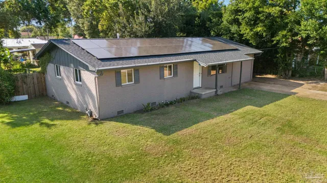 an aerial view of a house with swimming pool