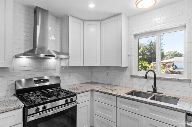 a bathroom with a sink and a window