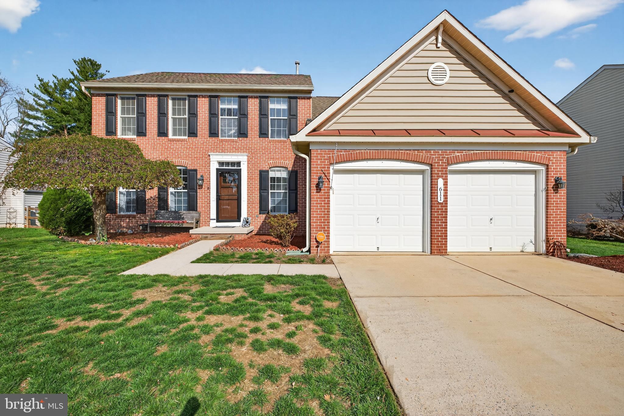 611 Hunting Ridge Drive Frederick, MD 21703 - Photo 1 of 50 a front view of a house with yard