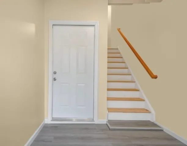 a view of an empty room with a window