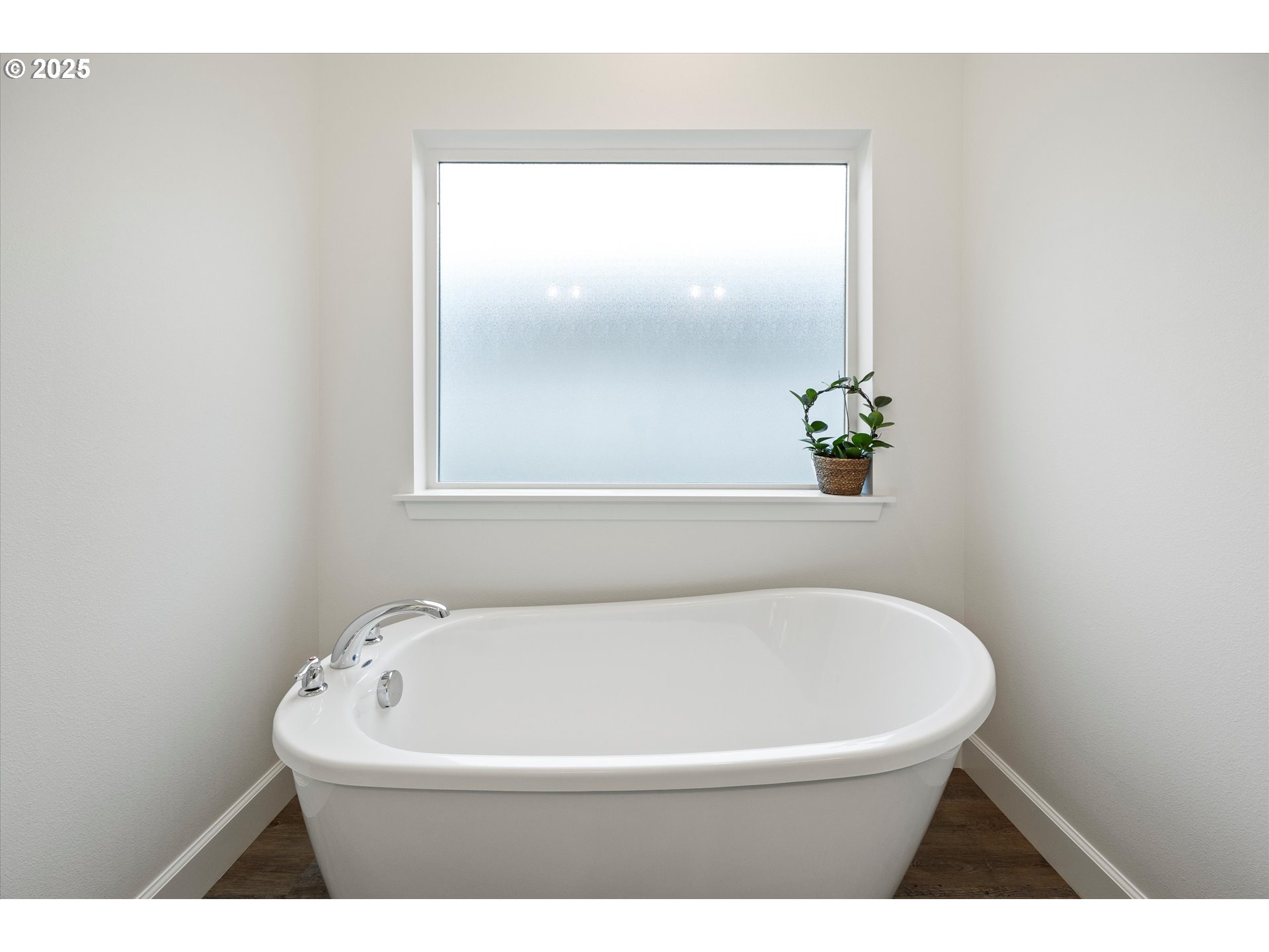 1678 Wilson Street Umatilla, OR 97882 - Photo 18 of 38 a white bath tub sitting in a bathroom