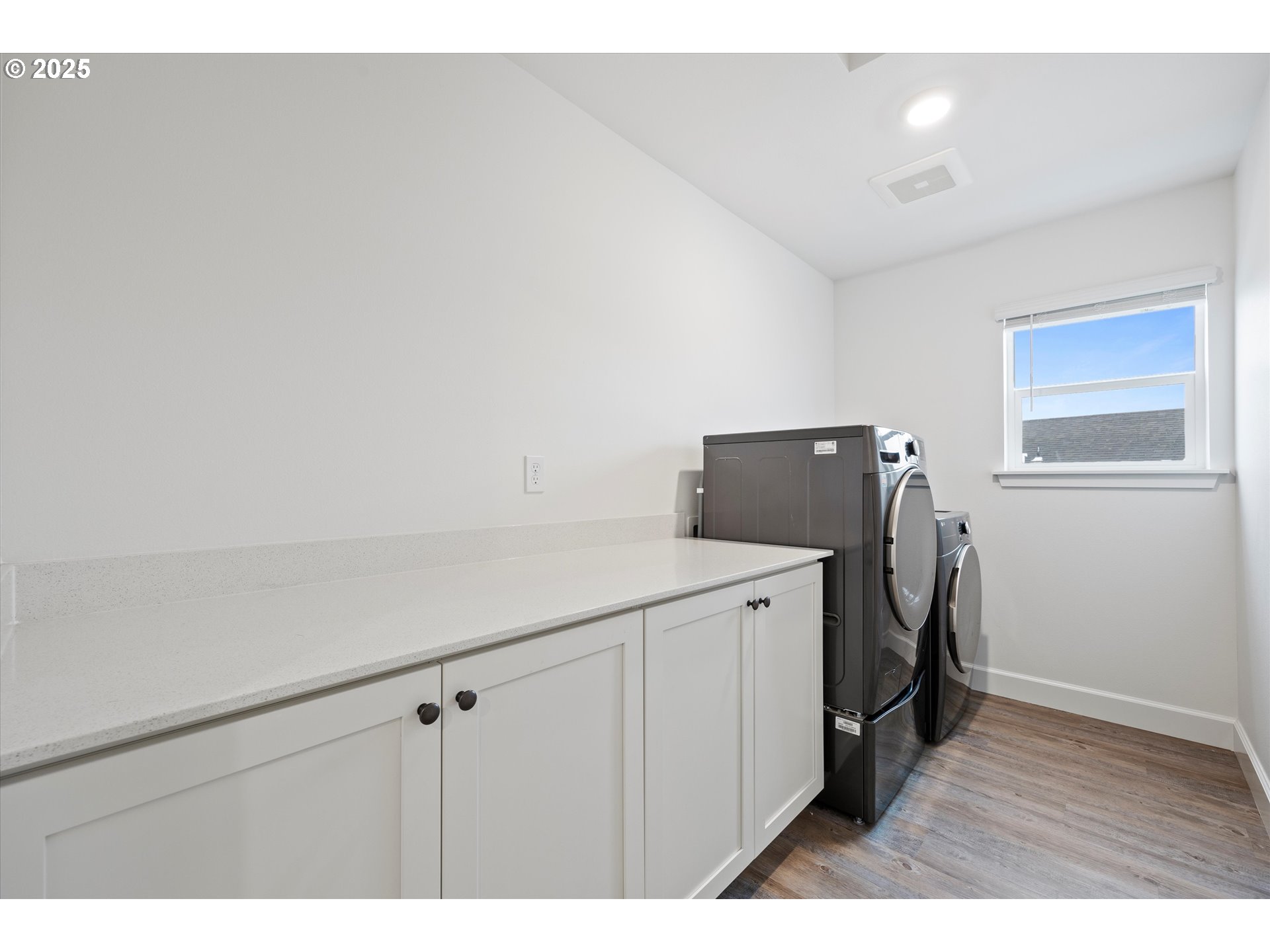 1678 Wilson Street Umatilla, OR 97882 - Photo 27 of 38 a kitchen with cabinets and wooden floor