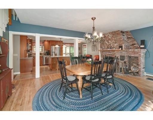 323 Bullard Road Oakham, MA 01068 - Photo 6 of 30 a view of a dining room with furniture and wooden floor
