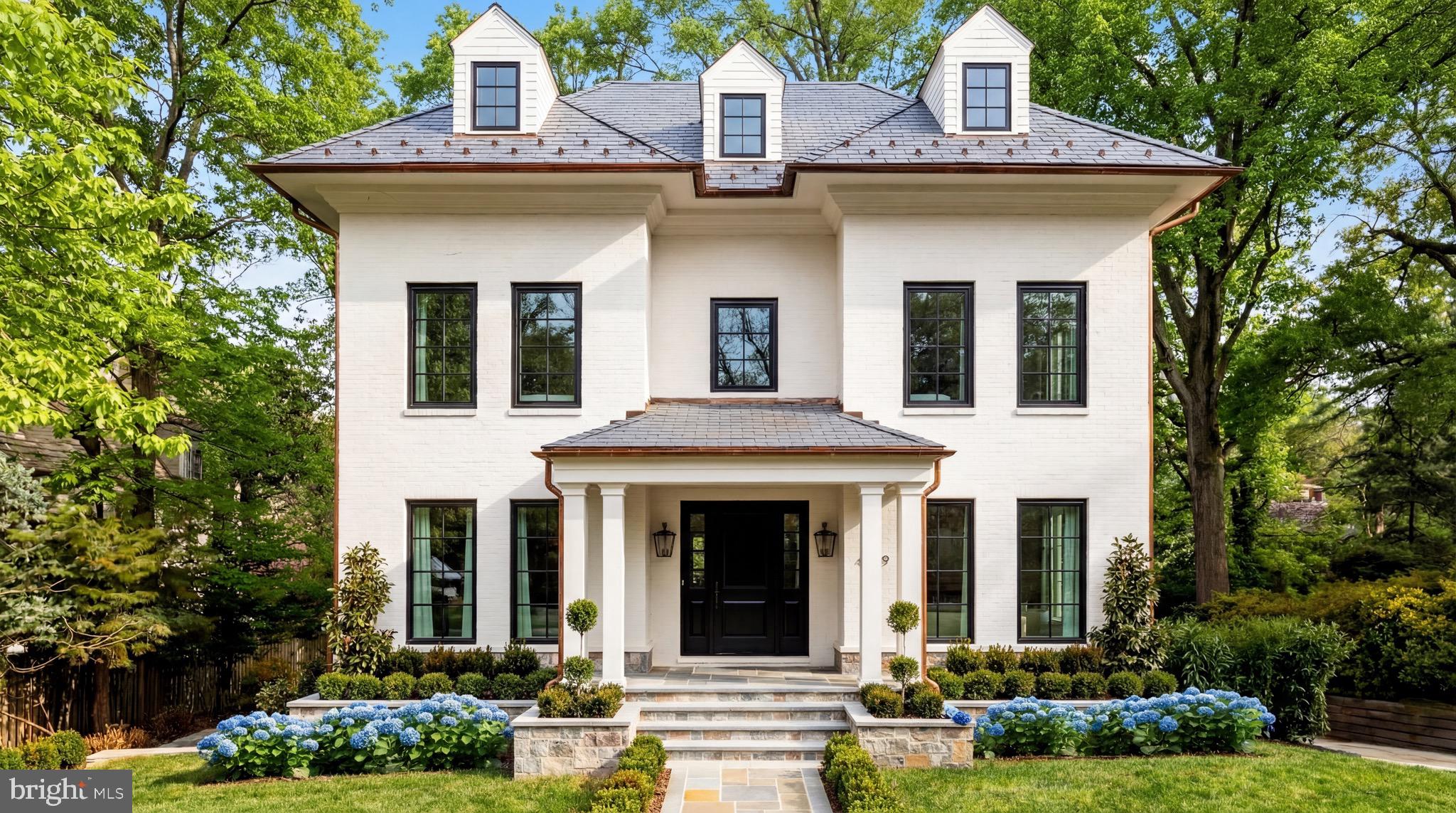 front view of a house with a yard