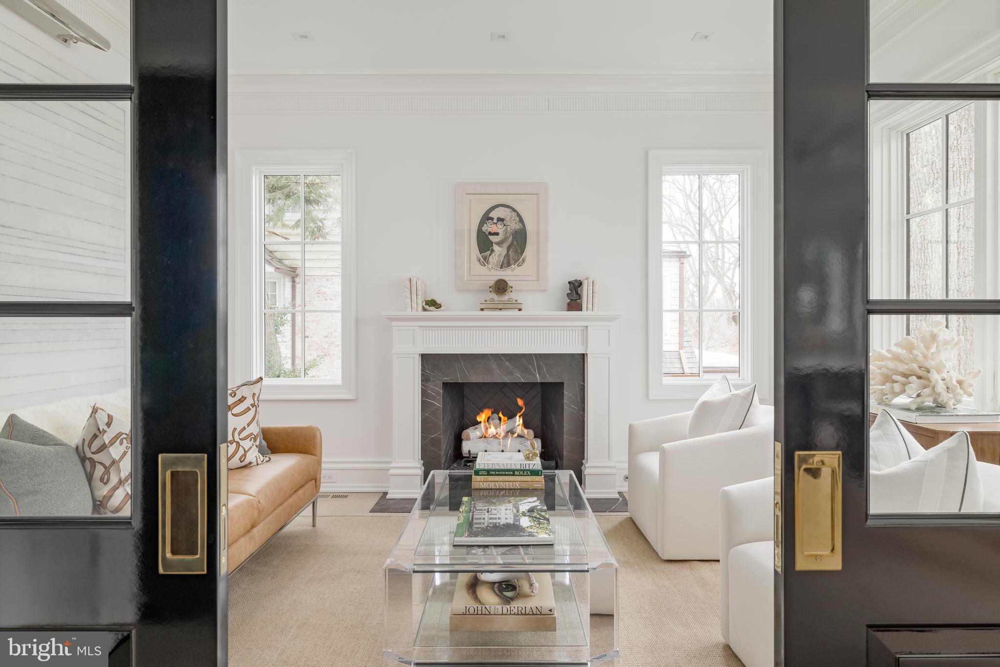 4939 Quebec Street Northwest Washington, DC 20016 - Photo 19 of 50 a living room with furniture and a fireplace