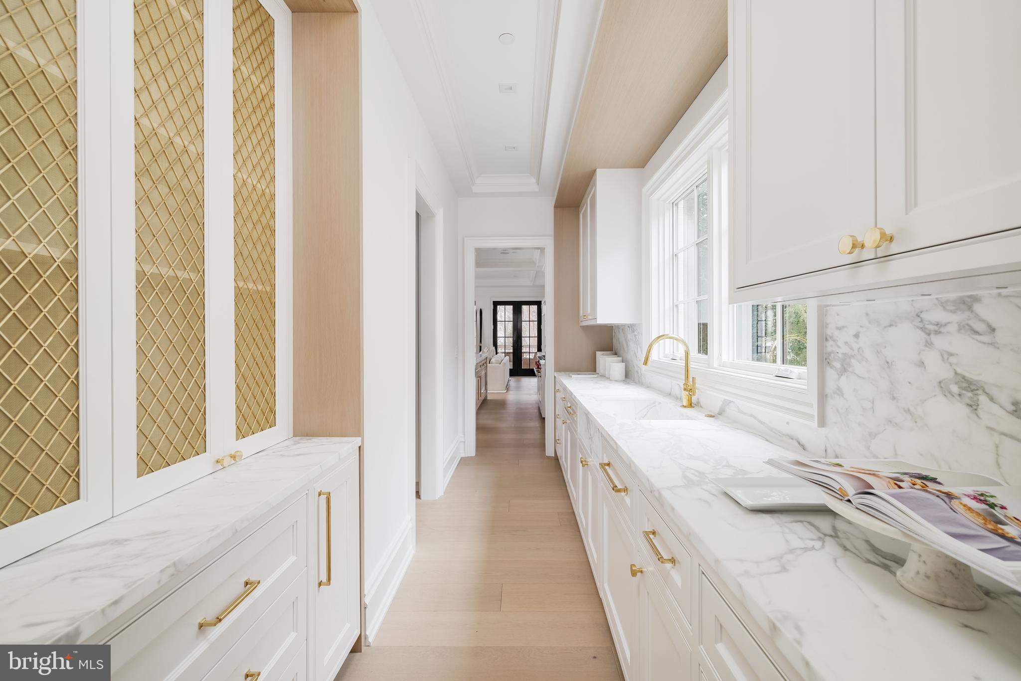 4939 Quebec Street Northwest Washington, DC 20016 - Photo 20 of 50 a bathroom with a granite countertop sink and a bathtub