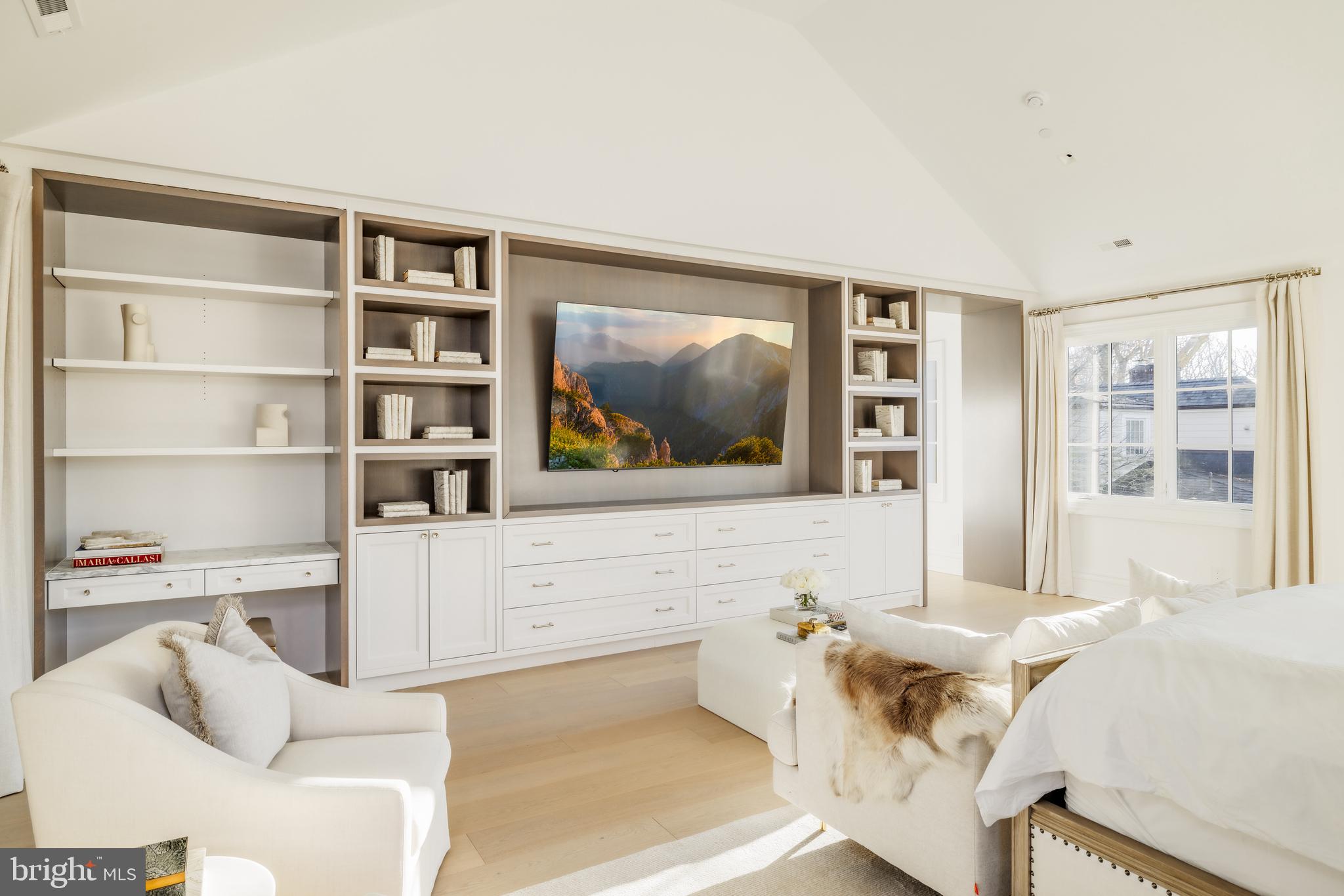 4939 Quebec Street Northwest Washington, DC 20016 - Photo 24 of 50 a living room with furniture and a flat screen tv