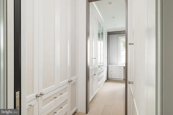 a bathroom with a double vanity sink mirror and shower