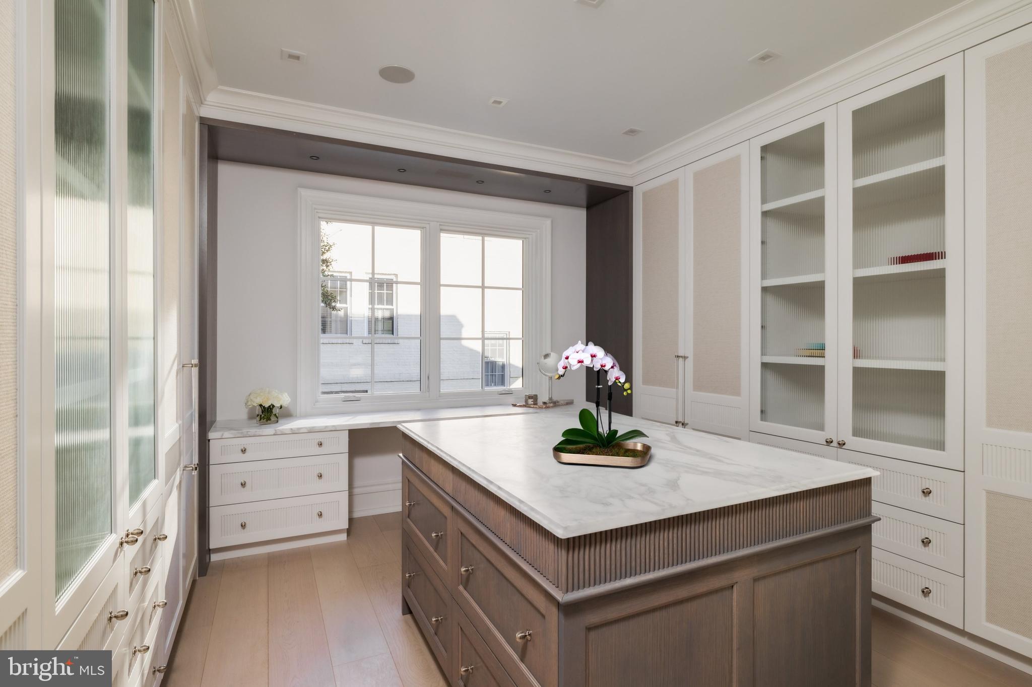 4939 Quebec Street Northwest Washington, DC 20016 - Photo 27 of 50 a kitchen with a sink cabinets and window