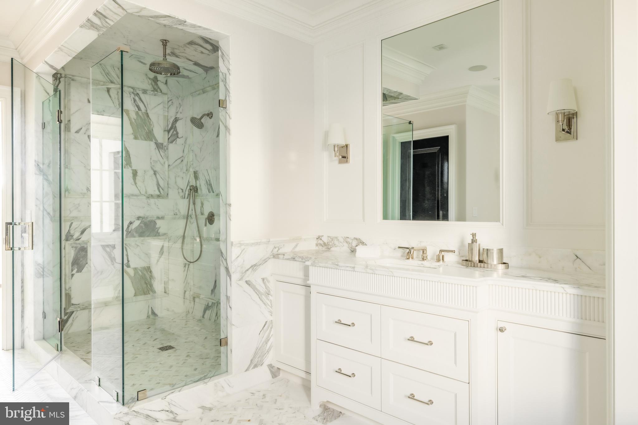 4939 Quebec Street Northwest Washington, DC 20016 - Photo 30 of 50 a bathroom with a double vanity sink mirror and shower