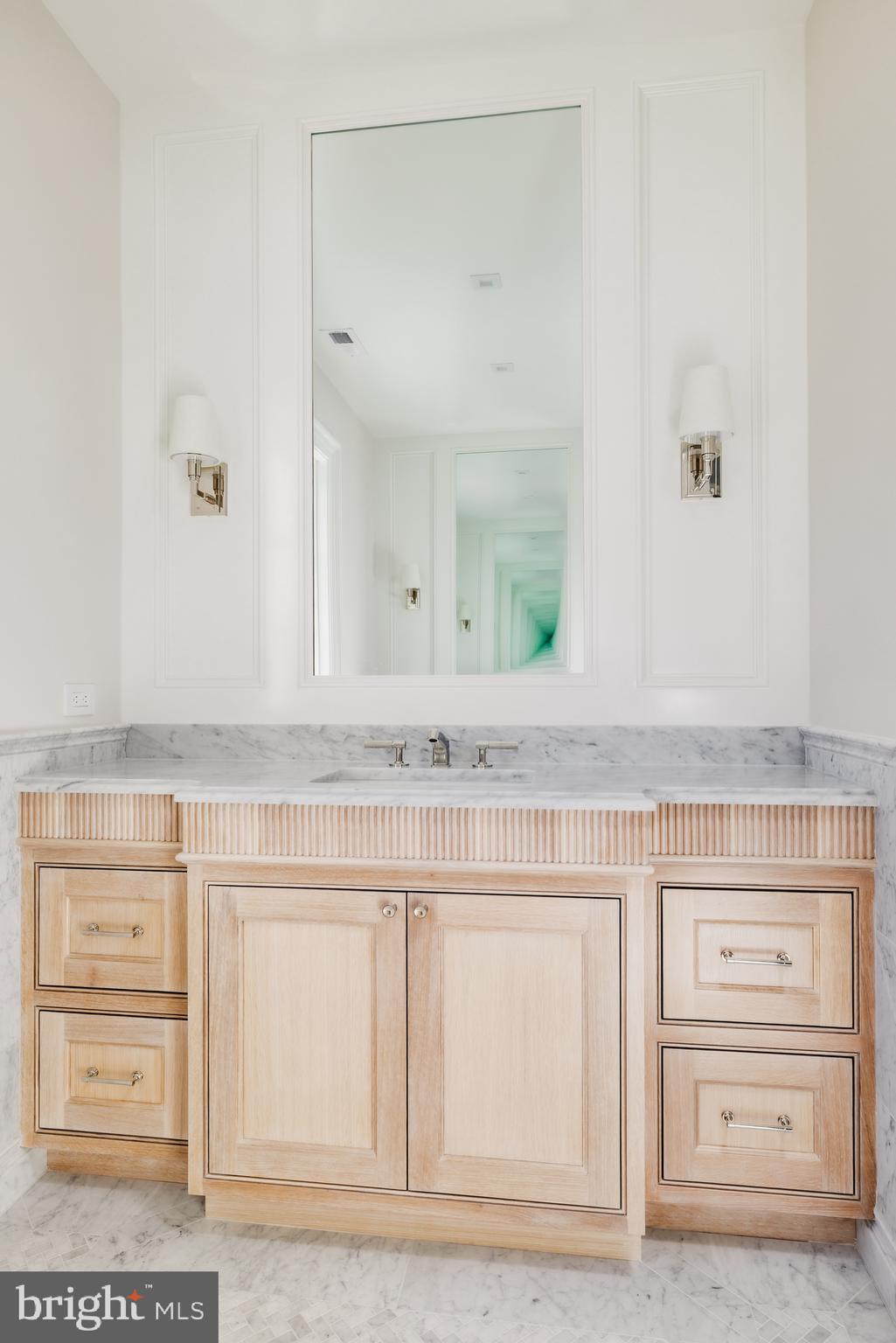 4939 Quebec Street Northwest Washington, DC 20016 - Photo 33 of 50 a bathroom with a sink and a mirror