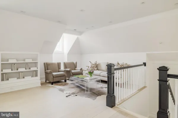 a living room with furniture and windows