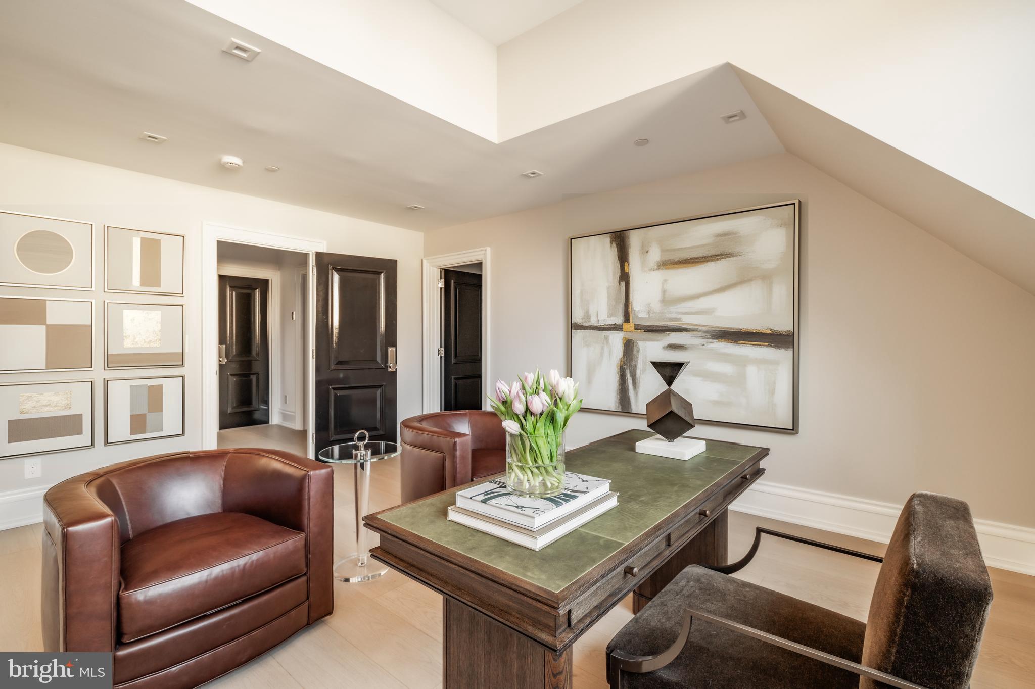 4939 Quebec Street Northwest Washington, DC 20016 - Photo 37 of 50 a living room with furniture and a window