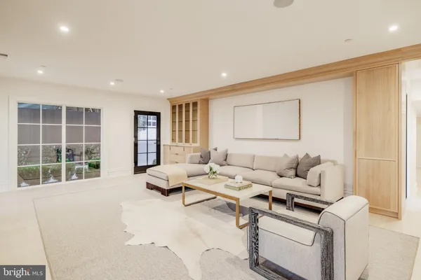 a living room with a fireplace and a flat screen tv