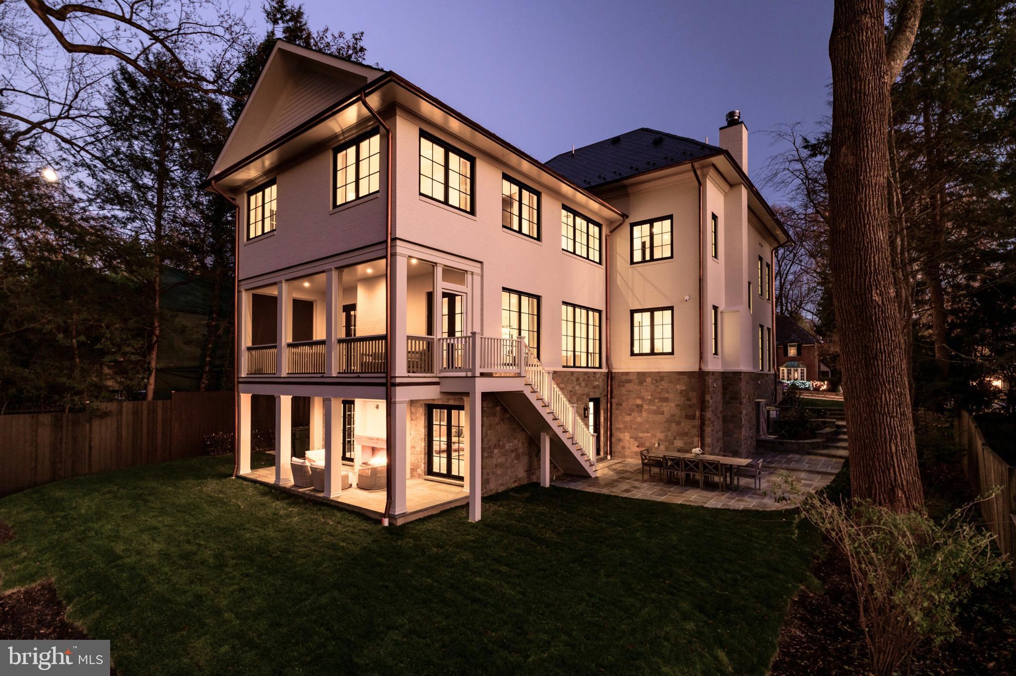 4939 Quebec Street Northwest Washington, DC 20016 - Photo 43 of 50 a front view of a house with a yard