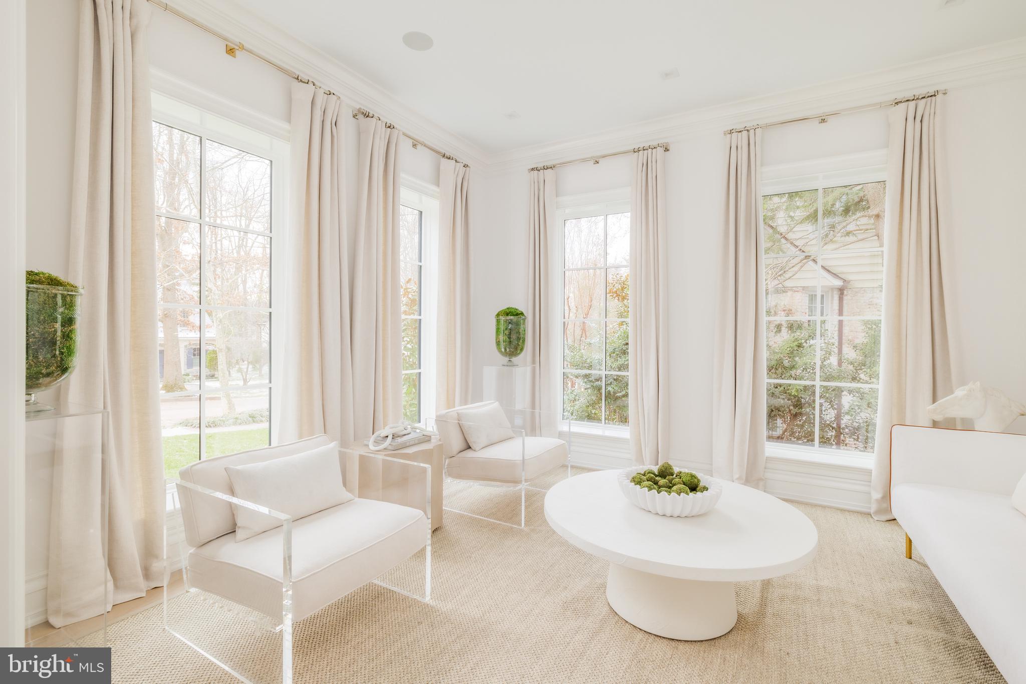 4939 Quebec Street Northwest Washington, DC 20016 - Photo 6 of 50 a living room with furniture and a large window