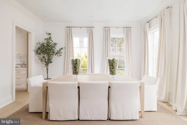 a spacious bathroom with a double vanity sink a mirror and a bathtub