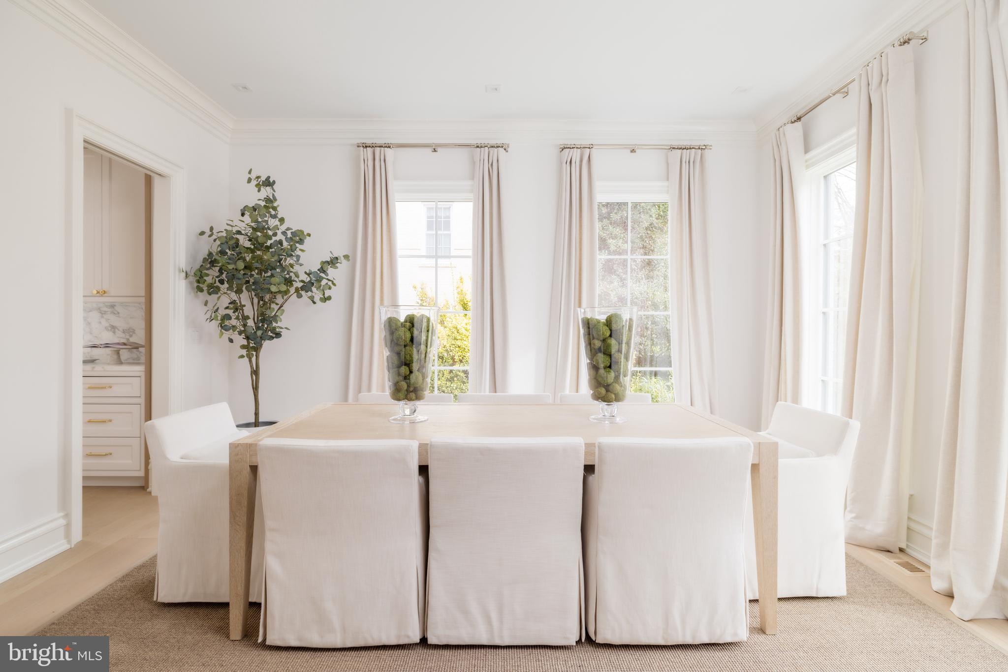 4939 Quebec Street Northwest Washington, DC 20016 - Photo 8 of 50 a white bath tub sitting in a room next to a window