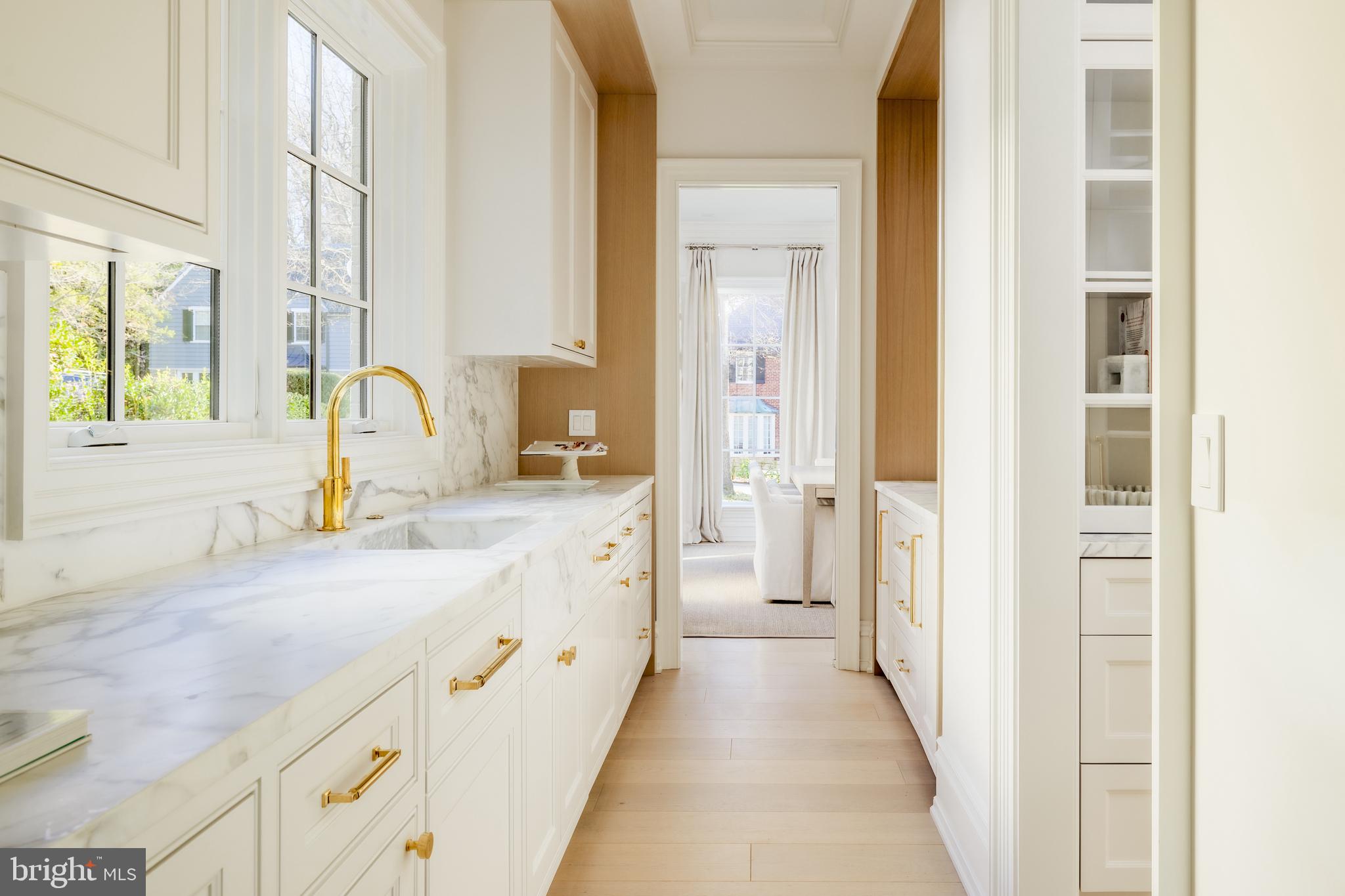 4939 Quebec Street Northwest Washington, DC 20016 - Photo 9 of 50 a spacious bathroom with a double vanity sink a mirror and a bathtub