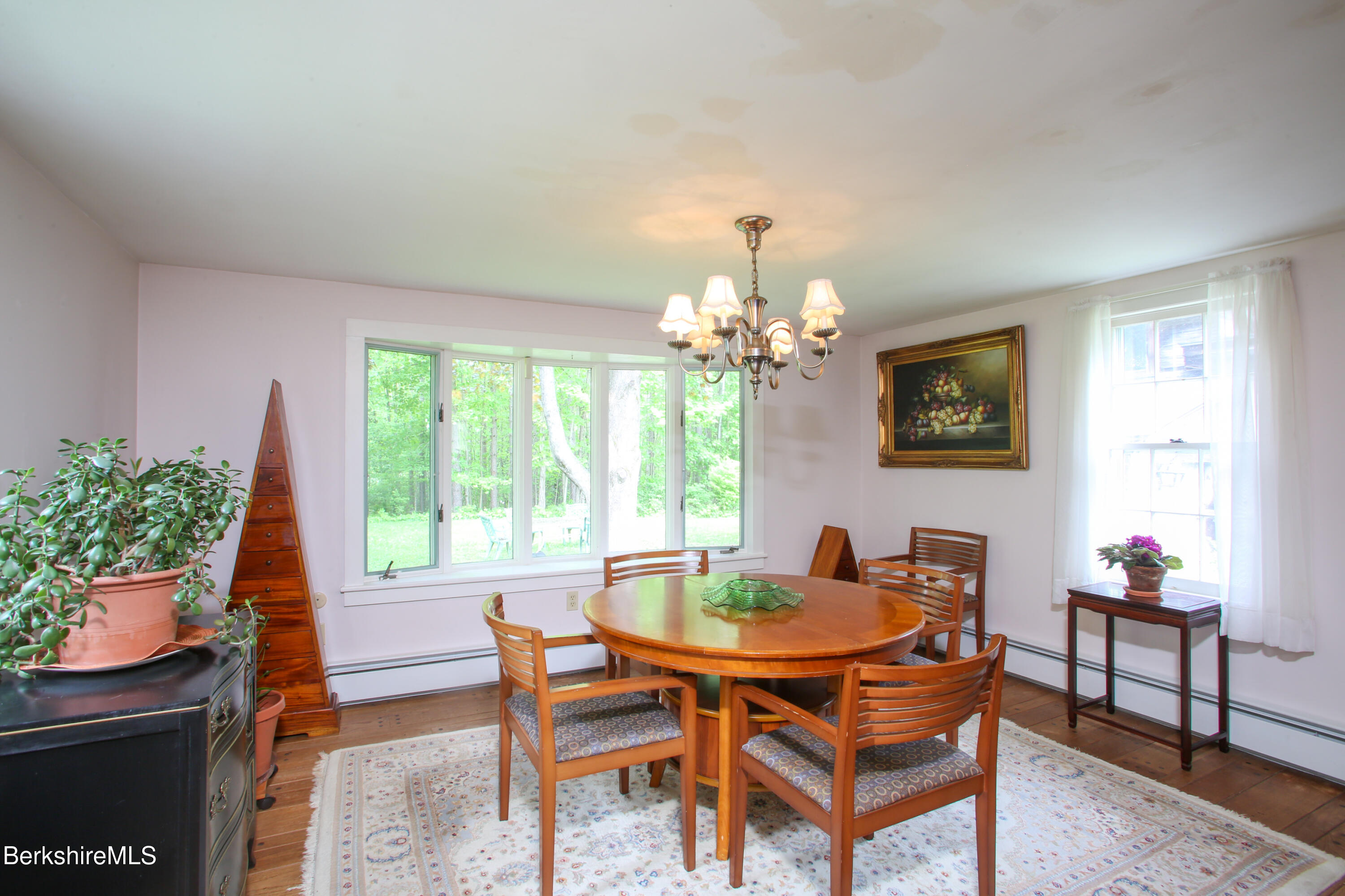 31 West Oxbow Road Charlemont, MA 01370 - Photo 11 of 39 a dining room with furniture a window and a chandelier