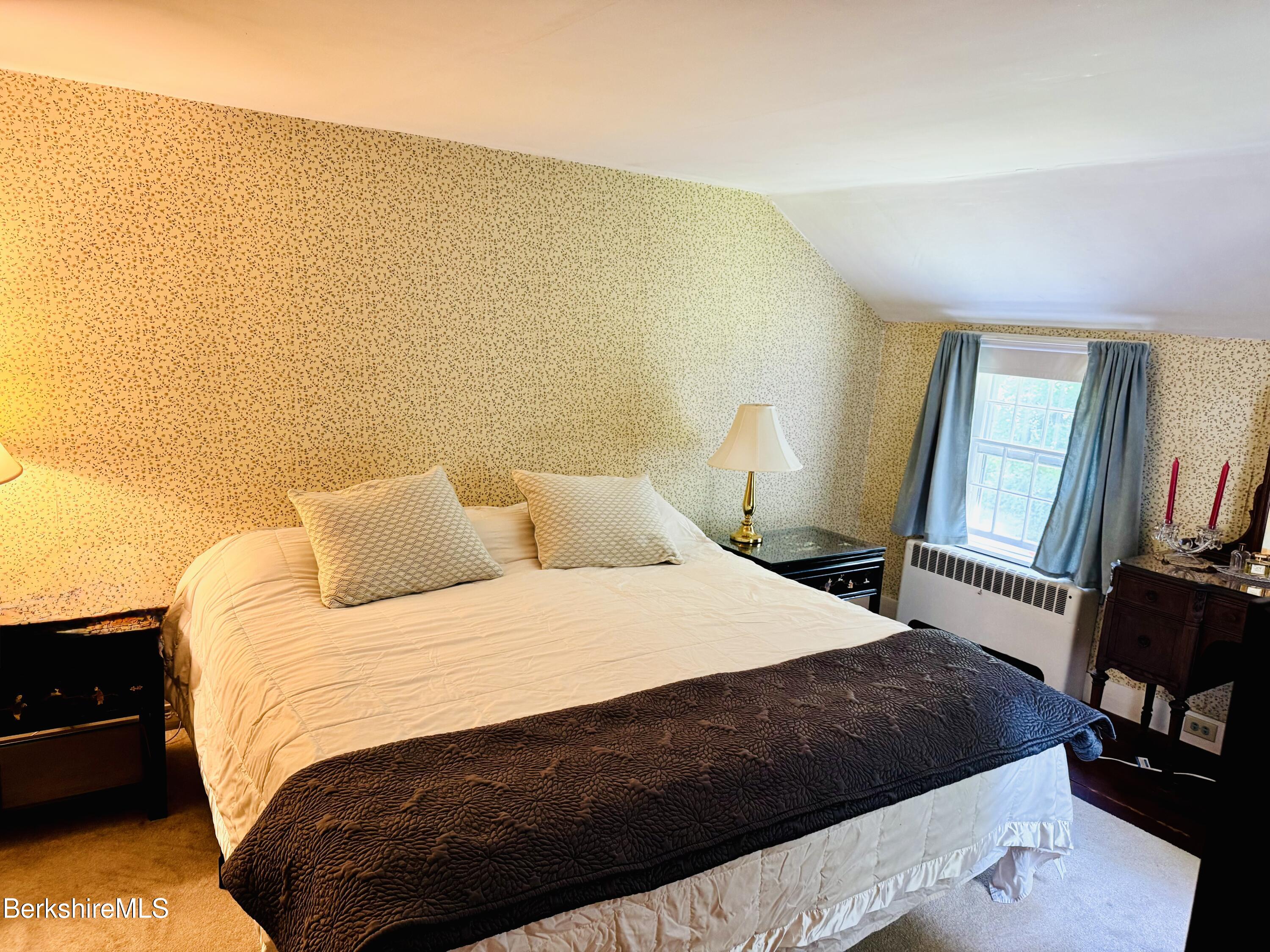 31 West Oxbow Road Charlemont, MA 01370 - Photo 17 of 39 a bedroom with a bed and wooden floor
