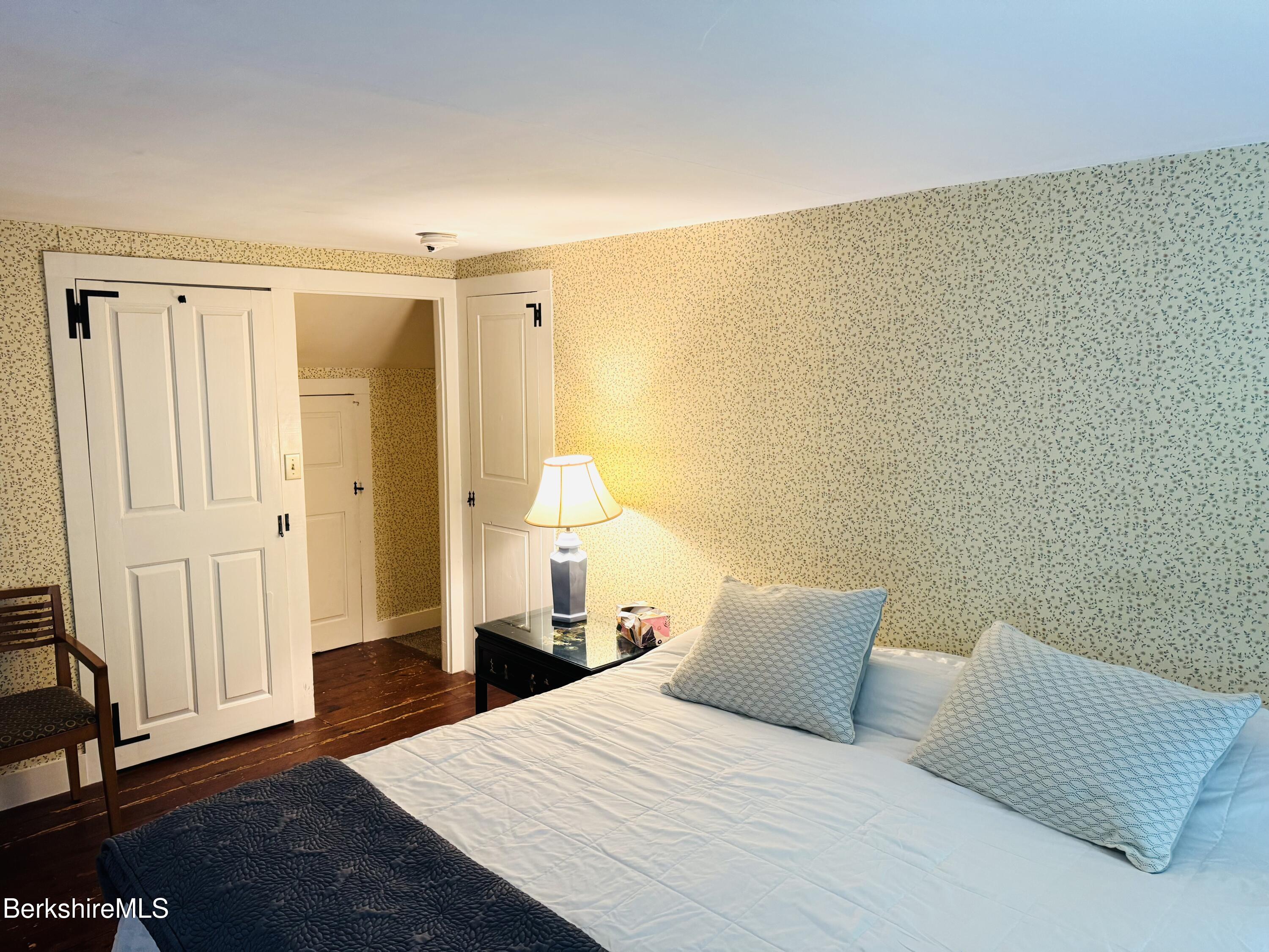 31 West Oxbow Road Charlemont, MA 01370 - Photo 18 of 39 a bedroom with a bed and wooden floor