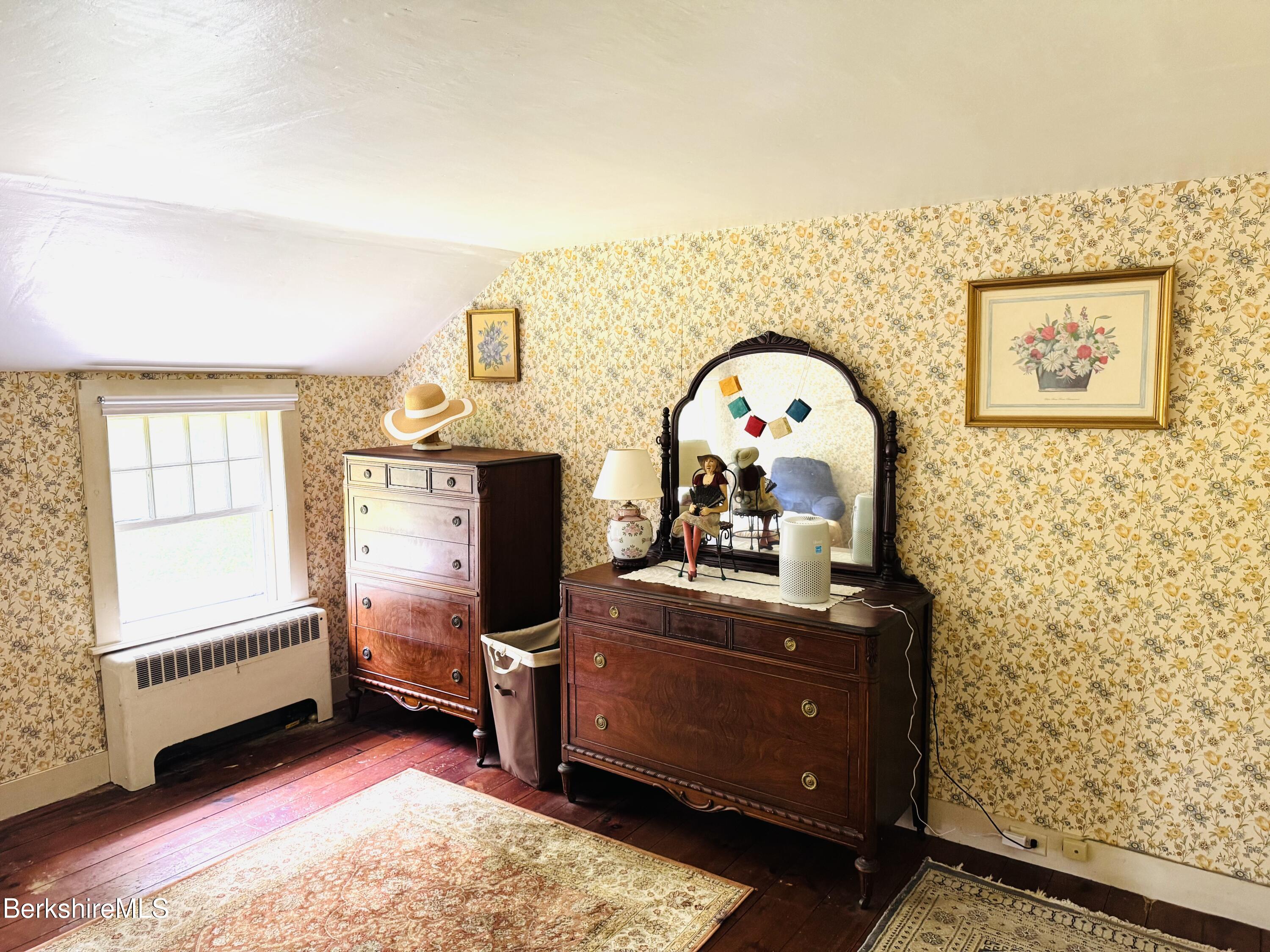 31 West Oxbow Road Charlemont, MA 01370 - Photo 22 of 39 a bedroom with a bed and wooden floor