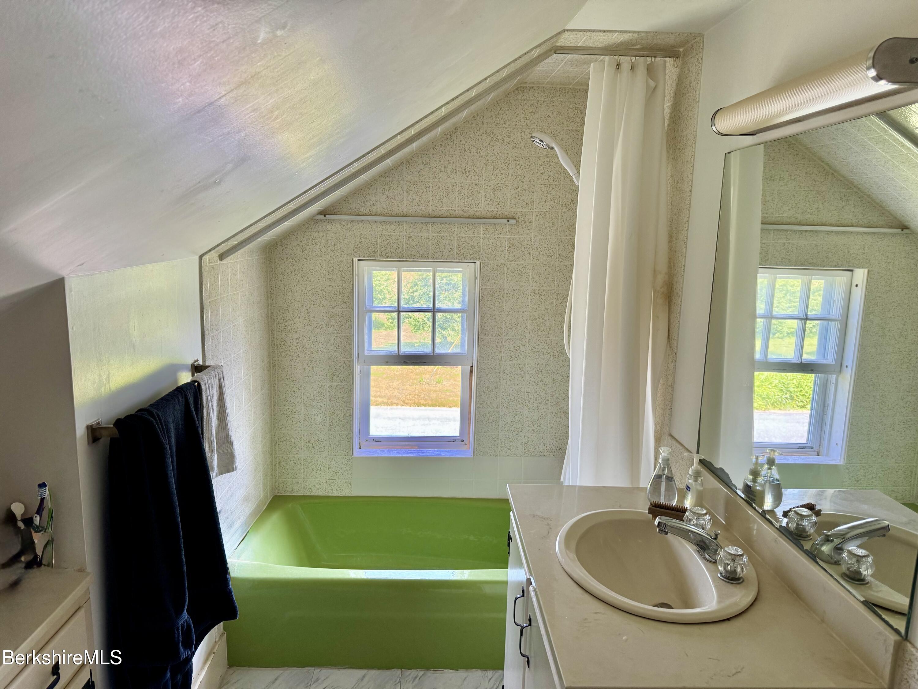 31 West Oxbow Road Charlemont, MA 01370 - Photo 23 of 39 a bathroom with a sink a tub and a mirror