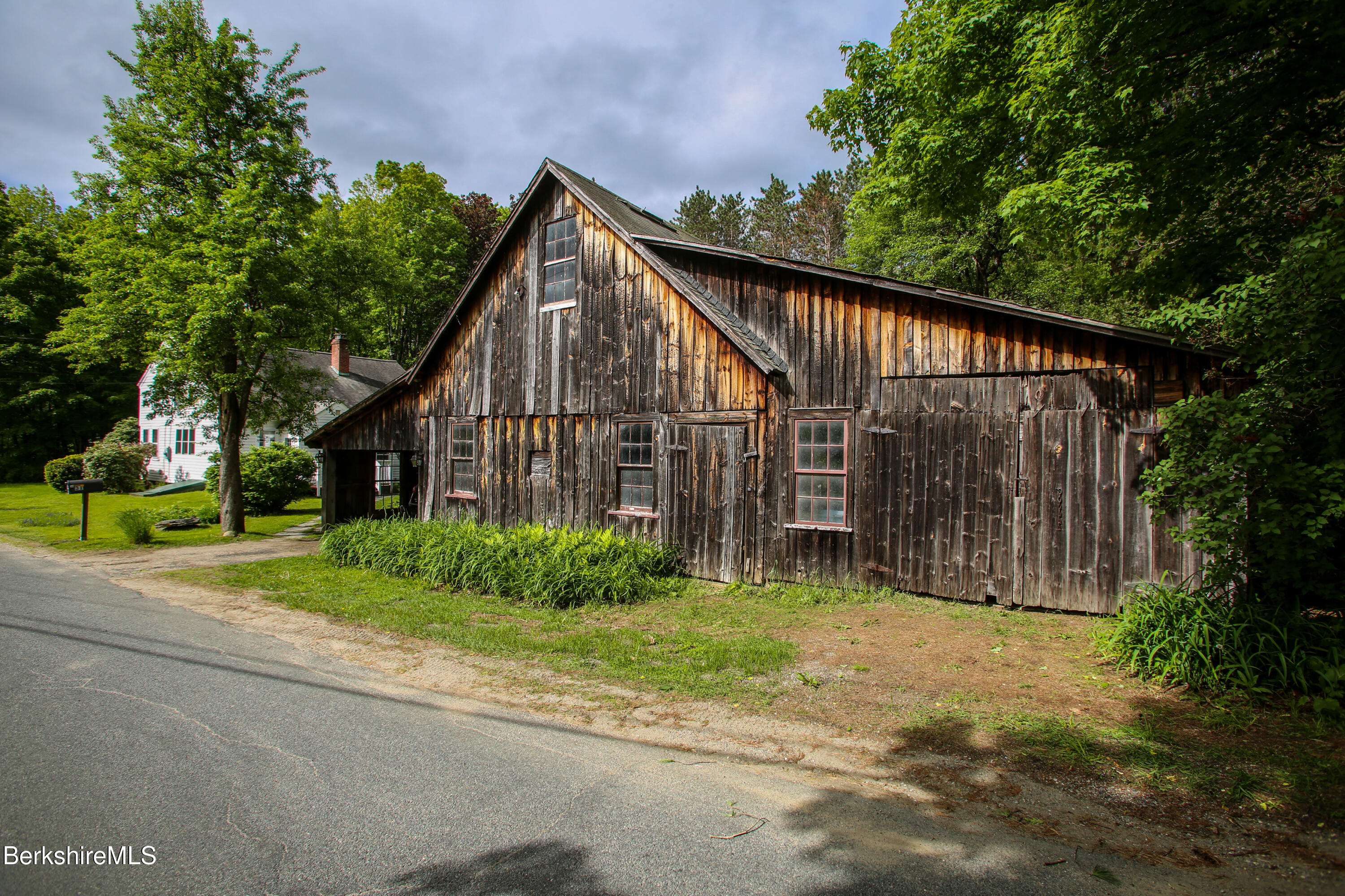 31 West Oxbow Road Charlemont, MA 01370 - Photo 24 of 39 a view of a house with a yard and plants