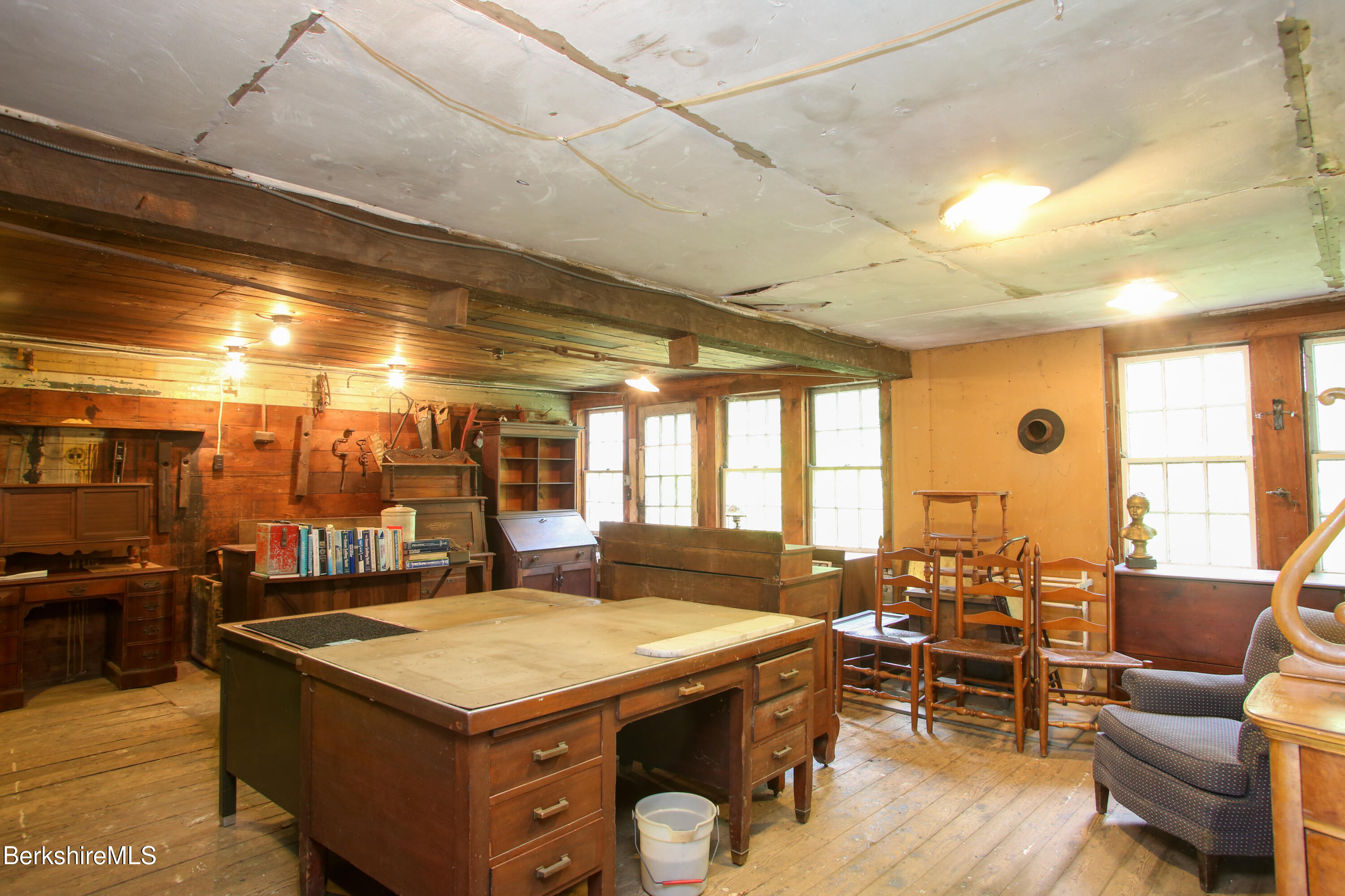 31 West Oxbow Road Charlemont, MA 01370 - Photo 26 of 39 a kitchen with a stove a counter space a sink and living room view