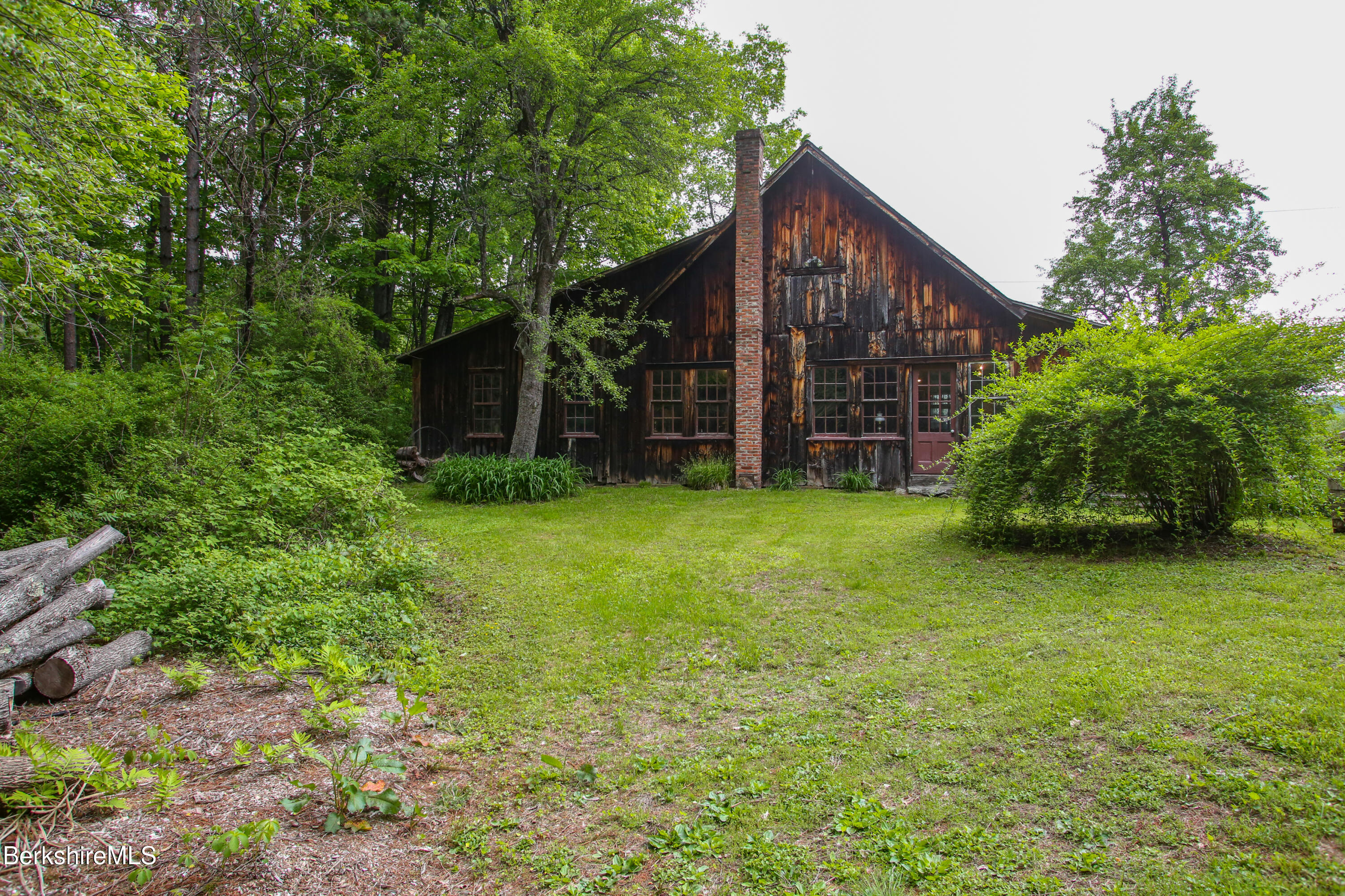 31 West Oxbow Road Charlemont, MA 01370 - Photo 30 of 39 a view of a house with backyard and trees