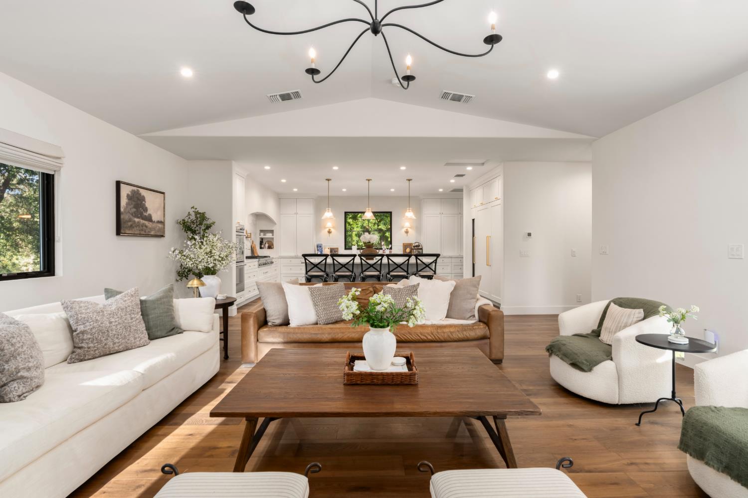 7697 Horseshoe Bar Road Loomis, CA 95650 - Photo 16 of 76 a living room with furniture kitchen view and a chandelier