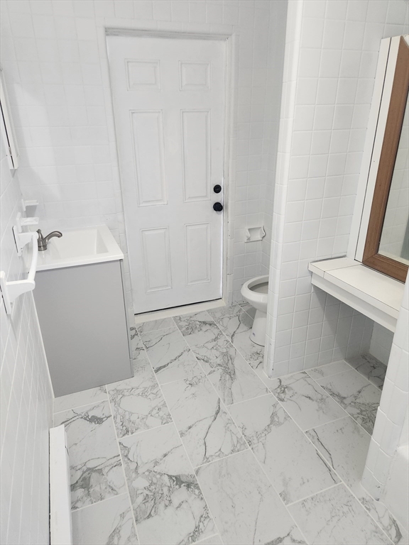 51 Everett Street, Unit 3 Everett, MA 02149 - Photo 4 of 4 a bathroom with a sink a toilet and shower
